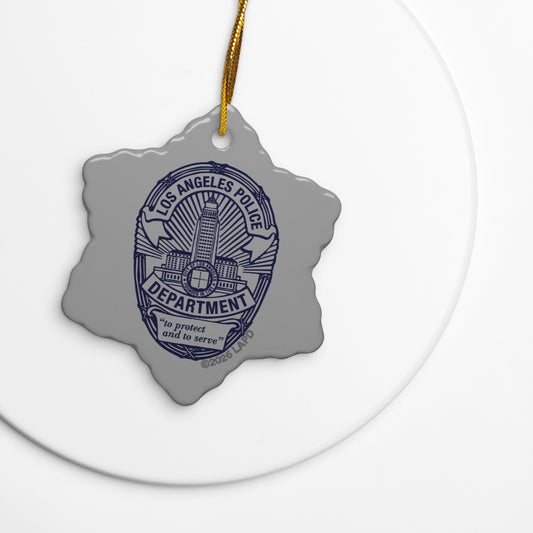Glossy ceramic LAPD badge ornament with a gold string against a neutral background-3
